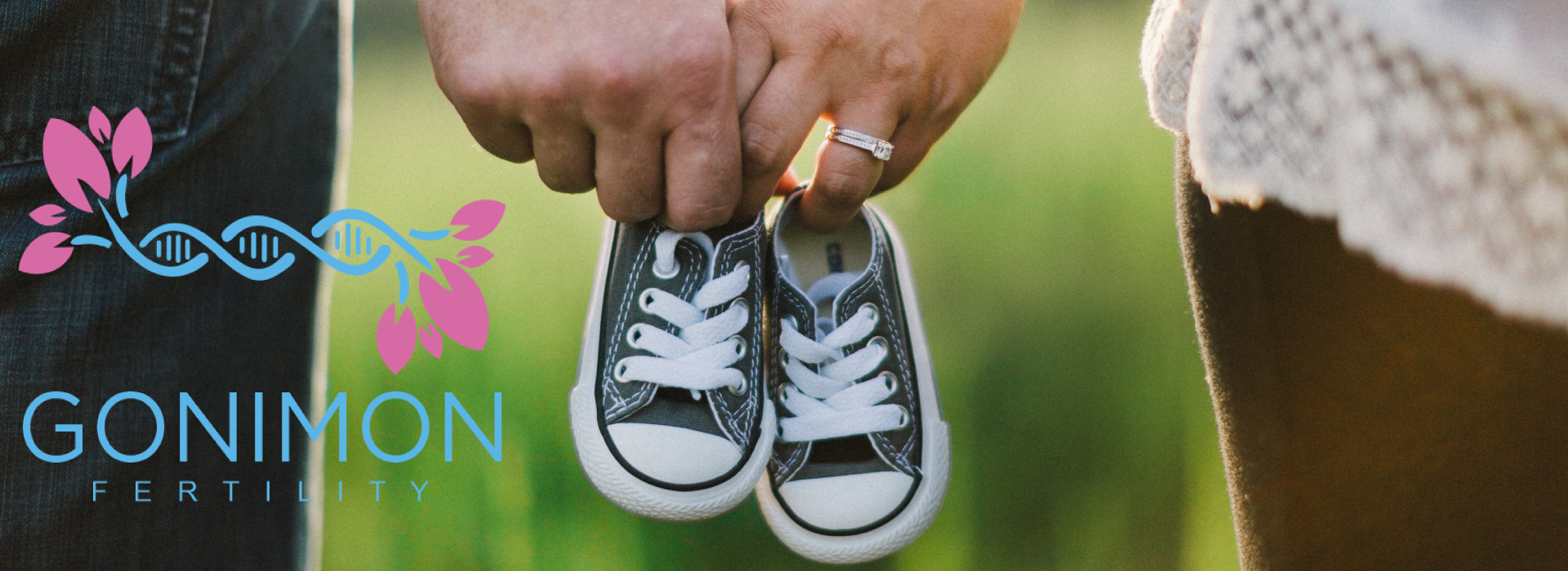 gonimon logo parents holding baby shoes